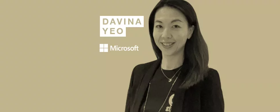 Person smiling in front of a beige background with text: Davina Yeo, Microsoft.