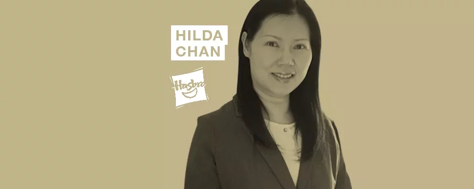 A person in professional attire with text 'Hilda Chan' and a logo in the background.