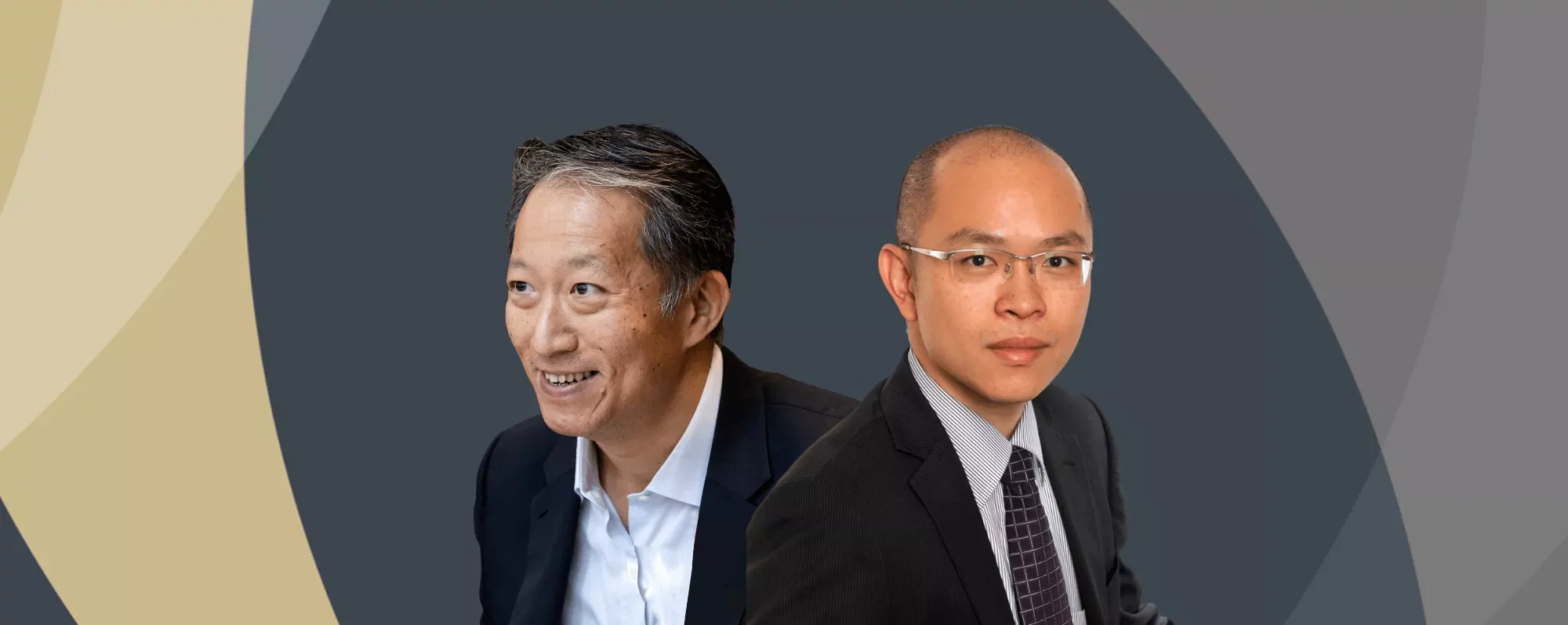 Two people wearing business suits against a dark abstract background.