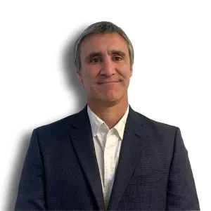 Portrait of a person wearing a suit and smiling at the camera.