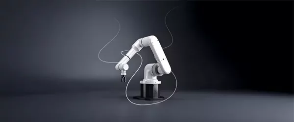 Industrial robotic arm positioned against a dark gradient background.
