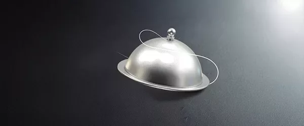 Silver cloche icon on a dark background.