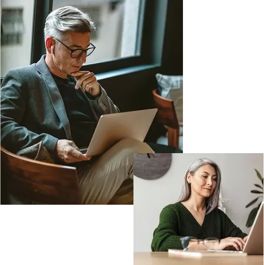 two persons working on laptop