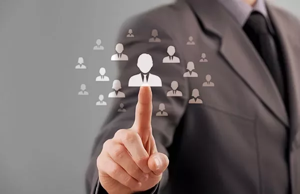Businessperson selecting an individual icon on a digital screen